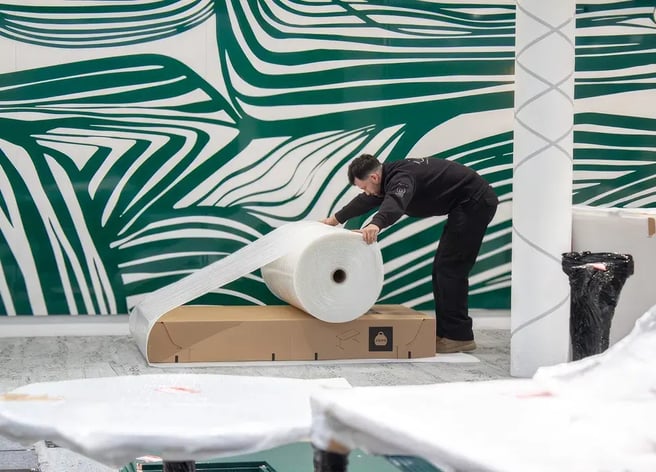 man-wrapping-up-furniture-for-removal